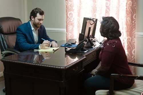 Brock & Stout Enterprise attorney meeting with a client
