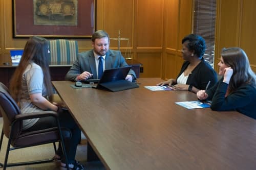 Brock & Stout Montgomery attorney meeting with clients